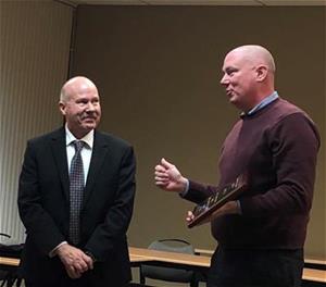 Chris Oakley, chair of the section, presenting the plaque to James W. Lux Chris Oakley, chair of the section, presenting the plaque to James W. Lux