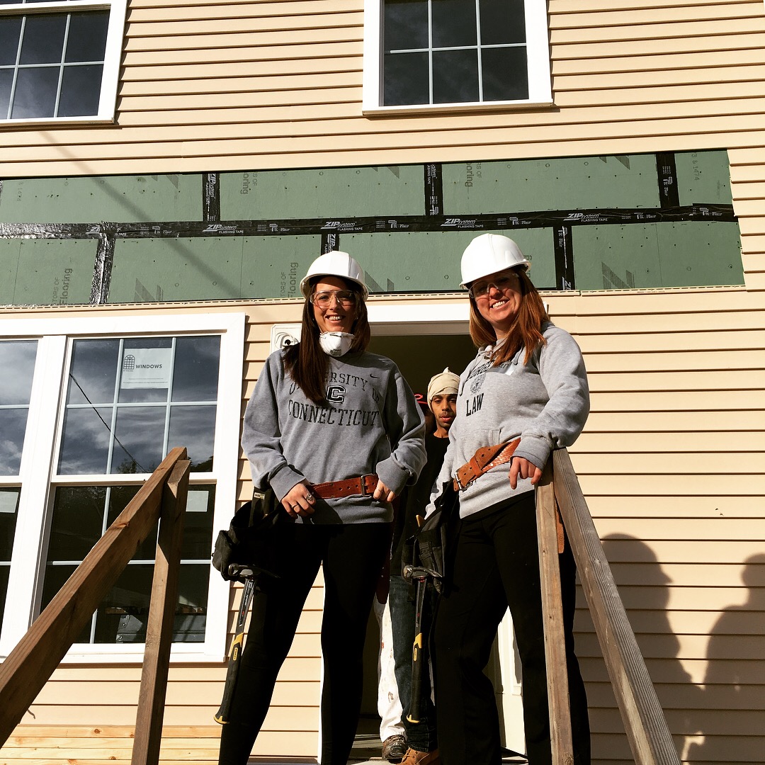 Molly C. Sanford and YLS Tax Law Committee Chair Lauren M. McNair help build a deck.