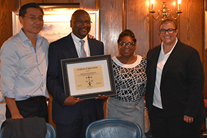 (L to R) Sung-Ho Hwang, Chief Justice Richard A. Robinson, Judge Angela C. Robinson, and CBA Immediate Past President Karen DeMeola at the LAW Camp reception. 