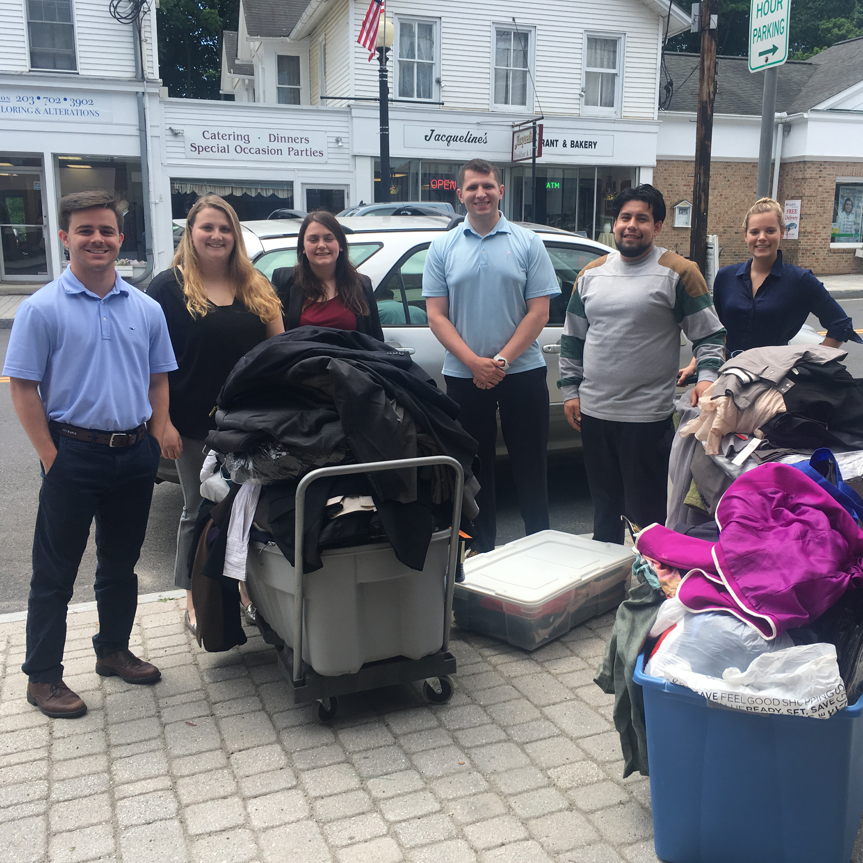 Members from the Save-A-Suit team accept the CBA YLS’ donation of professional attire.