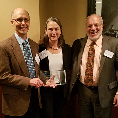 Douglas Jackson and Helen Rubino-Turco accept the Environmental Law Section’s Clyde O. Fisher, Jr. Award from Timothy S. Hollister.